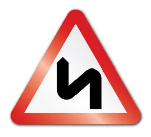 Double bend ahead, first to the left symbol (Self Adhesive)